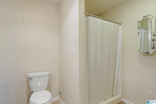 bathroom with walk in shower and toilet