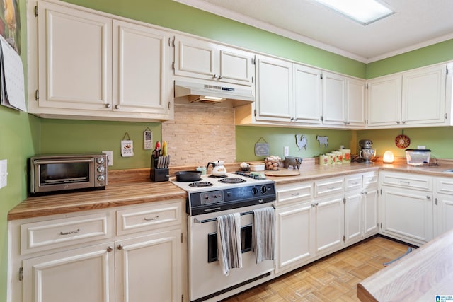 kitchen with white cabinets, stove, light parquet floors, and crown molding