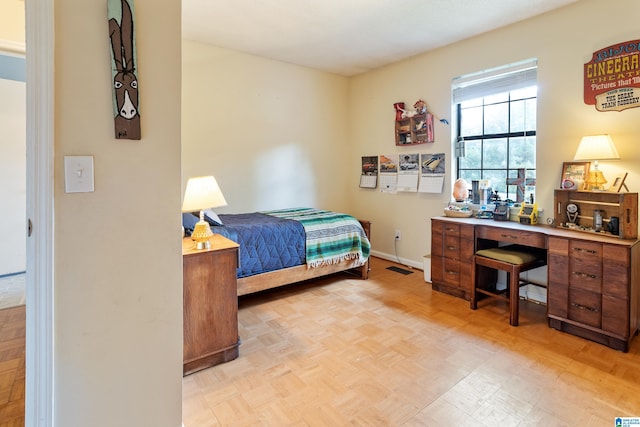 bedroom featuring baseboards