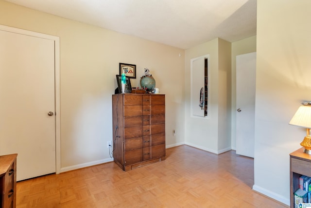 bedroom featuring light parquet flooring