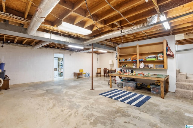 unfinished below grade area featuring stairs