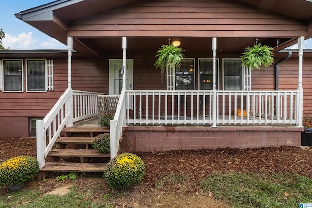 doorway to property featuring a porch