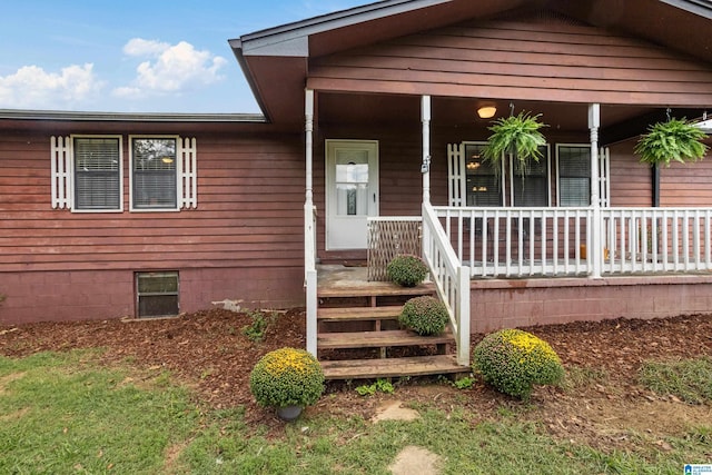 view of front of property with a porch and crawl space