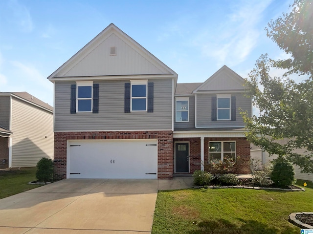 view of front of house with a garage and a front lawn