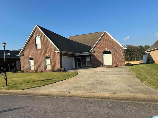 view of front facade featuring a front lawn and a garage