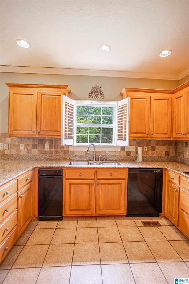 kitchen with black dishwasher, ornamental molding, sink, decorative backsplash, and light tile patterned flooring