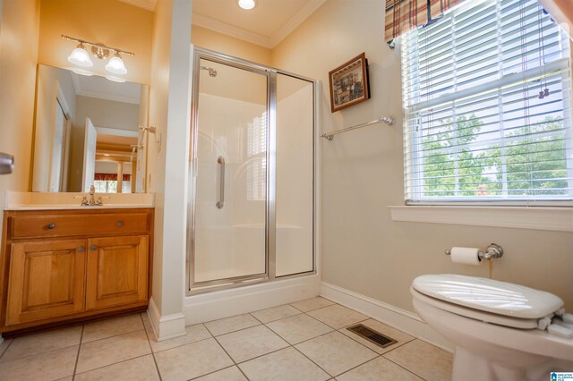 bathroom featuring vanity, a shower with shower door, tile patterned flooring, crown molding, and toilet