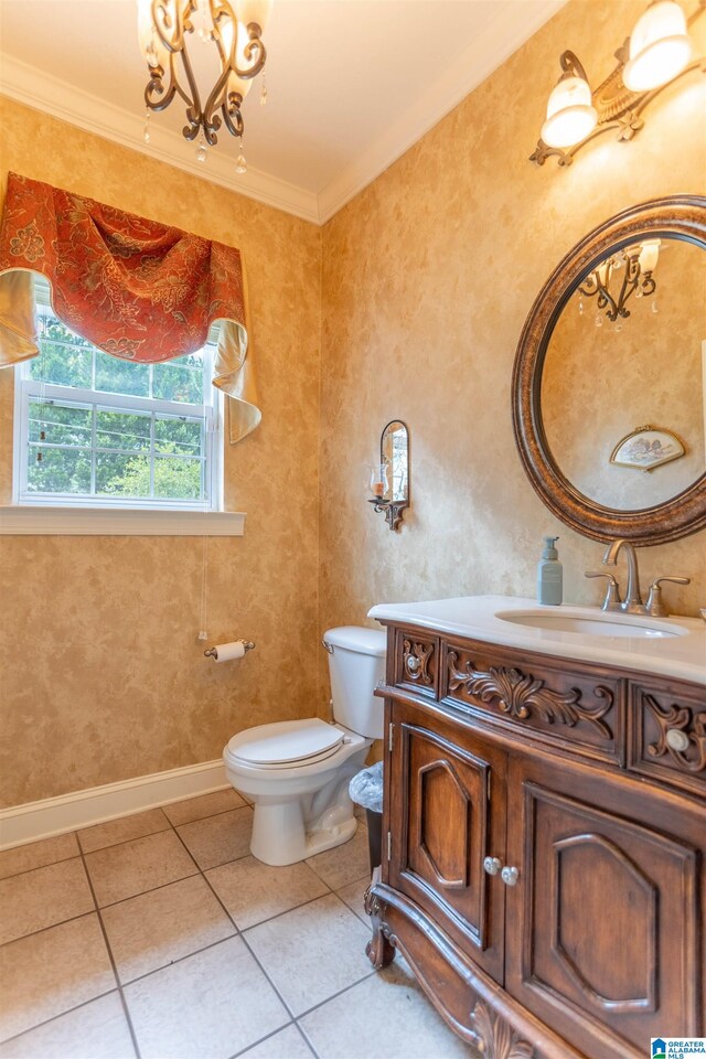 bathroom featuring crown molding, vanity, toilet, and tile patterned floors