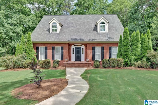 new england style home with a front lawn