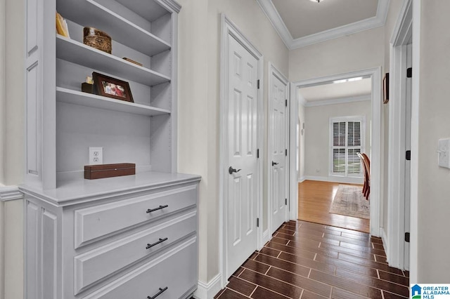 hallway with ornamental molding and dark hardwood / wood-style floors