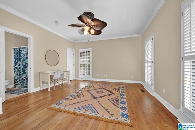 interior space featuring light hardwood / wood-style flooring, ceiling fan, and ornamental molding