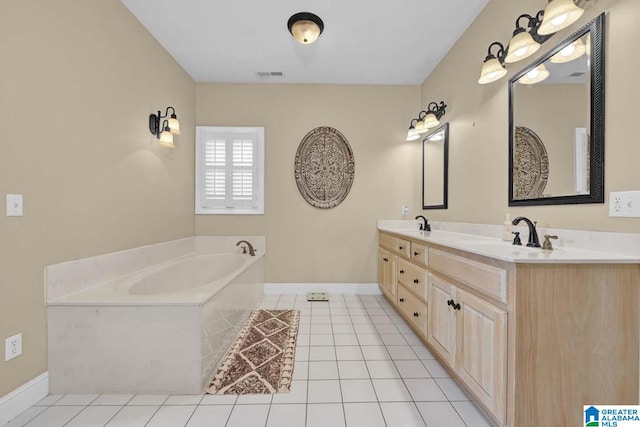 bathroom with tile patterned flooring, a tub to relax in, and vanity