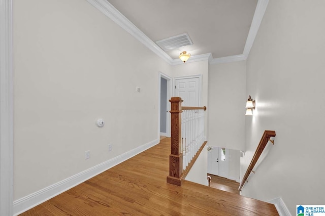 interior space with light hardwood / wood-style floors and ornamental molding