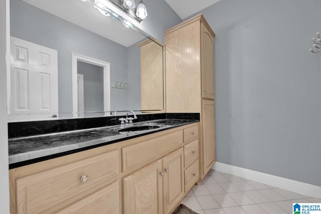 bathroom with vanity and tile patterned flooring