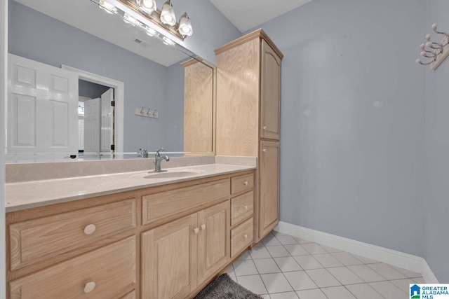 bathroom with tile patterned flooring and vanity