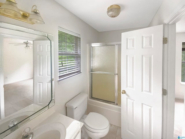 full bathroom with vanity, toilet, enclosed tub / shower combo, tile patterned floors, and ceiling fan