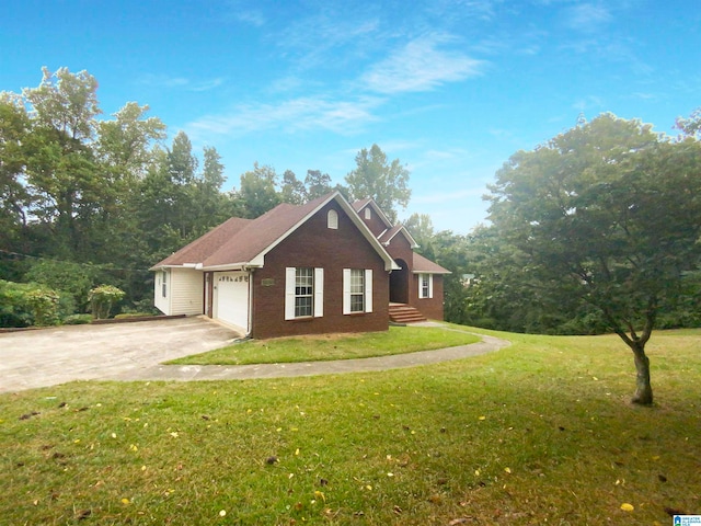 view of front of house featuring a front lawn and a garage