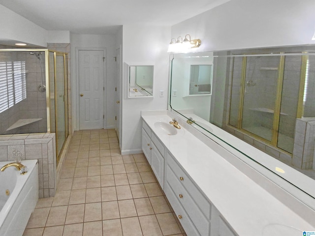 bathroom featuring tile patterned floors, independent shower and bath, and vanity