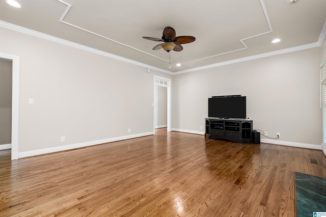 unfurnished living room featuring crown molding, ceiling fan, and hardwood / wood-style floors