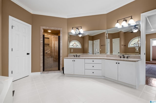 bathroom with an enclosed shower, tile patterned flooring, ornamental molding, vanity, and ceiling fan