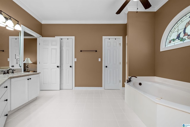 bathroom with ceiling fan, a bathing tub, ornamental molding, and vanity