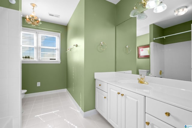 bathroom with a shower, tile patterned flooring, toilet, and vanity