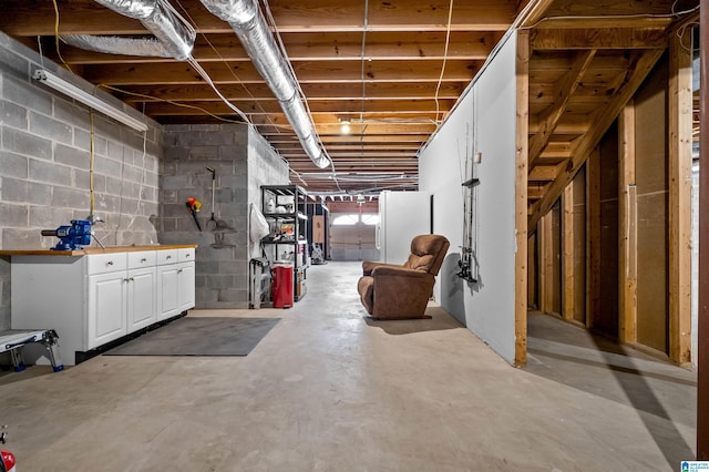 basement featuring white fridge