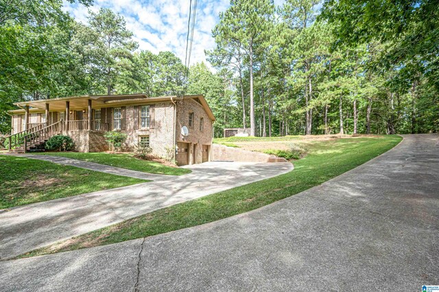 exterior space featuring a porch and a front lawn