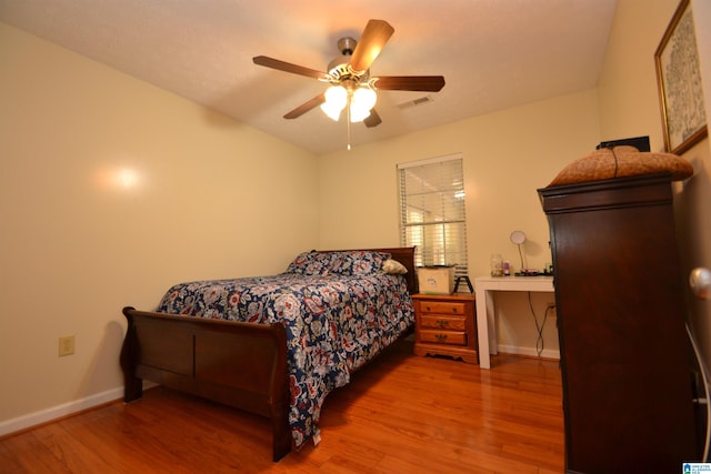 bedroom featuring wood-type flooring and ceiling fan