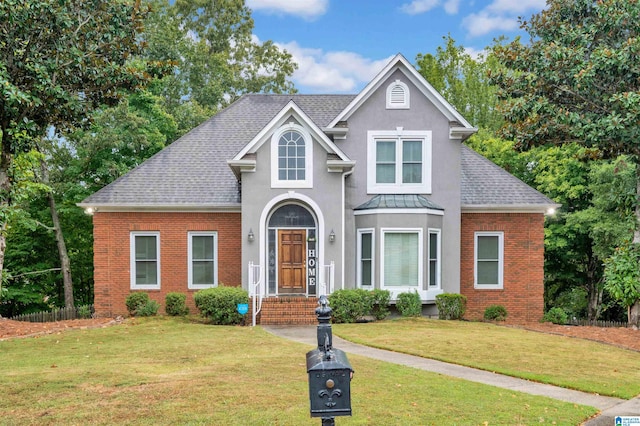 view of property featuring a front yard