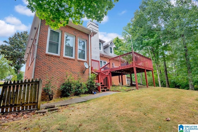 exterior space featuring a front yard and a deck