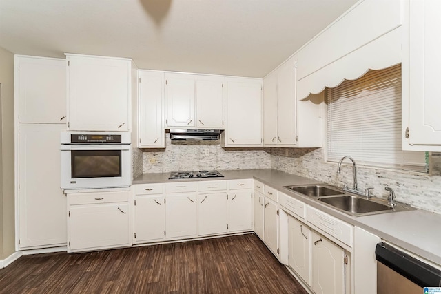 kitchen featuring dishwasher, dark hardwood / wood-style flooring, white cabinetry, and white oven