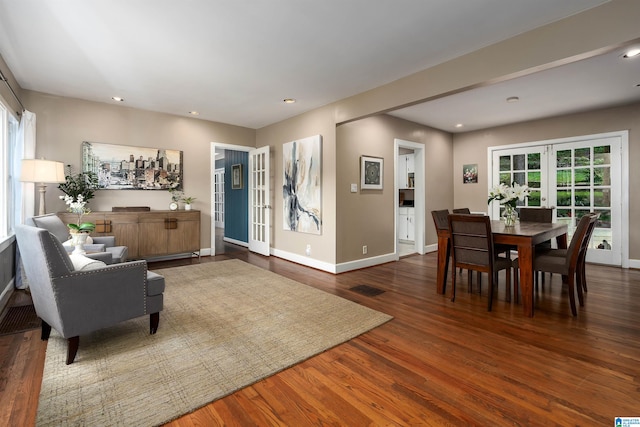 living room featuring dark hardwood / wood-style flooring and plenty of natural light