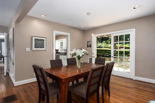 dining space with dark wood-type flooring