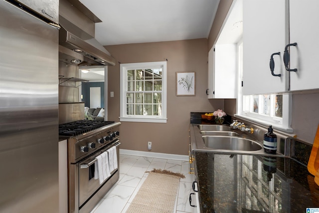 kitchen featuring island range hood, white cabinetry, sink, and stainless steel appliances