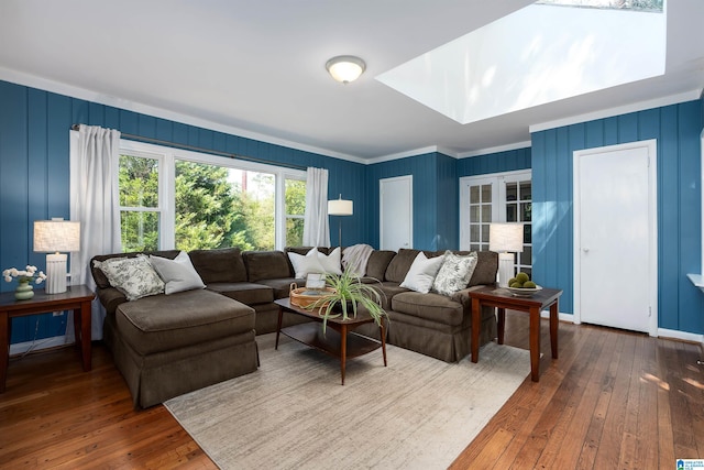 living room featuring crown molding and dark hardwood / wood-style flooring