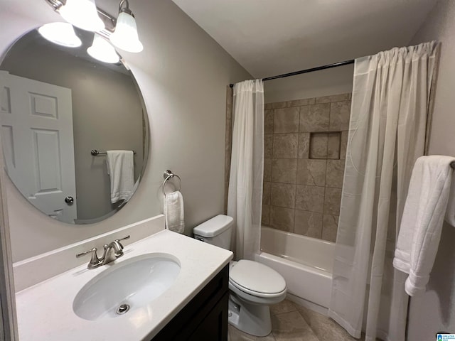 full bathroom featuring shower / bath combo with shower curtain, tile patterned floors, toilet, and vanity