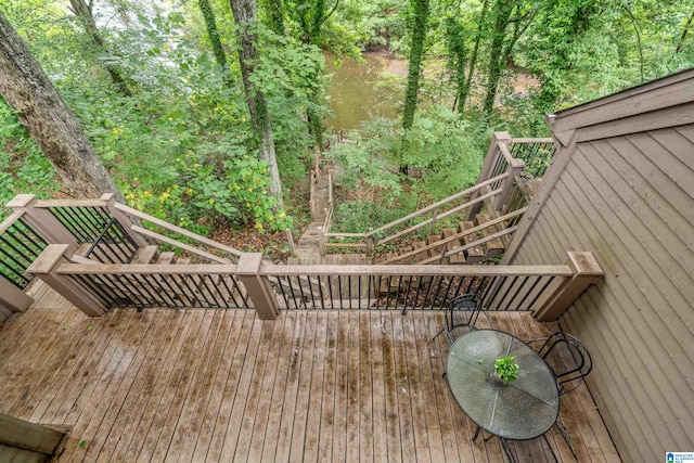 wooden terrace with a water view