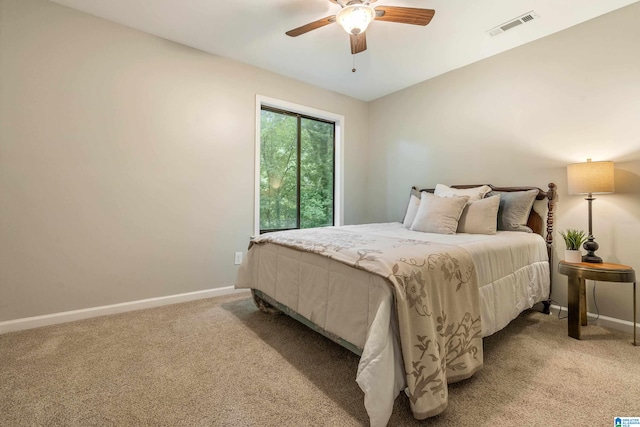 bedroom with light carpet and ceiling fan