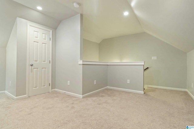 bonus room featuring light carpet and lofted ceiling