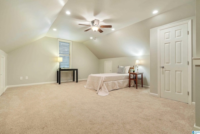 carpeted bedroom featuring ceiling fan and vaulted ceiling