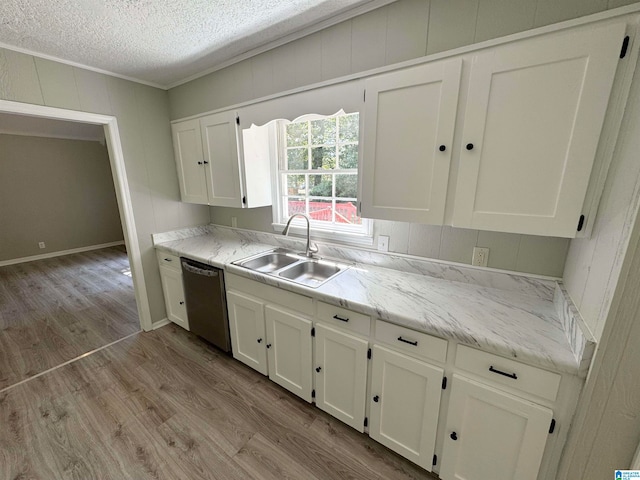 kitchen featuring a textured ceiling, dishwasher, light hardwood / wood-style flooring, sink, and white cabinets