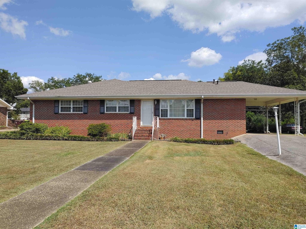 ranch-style house with a front lawn and a carport