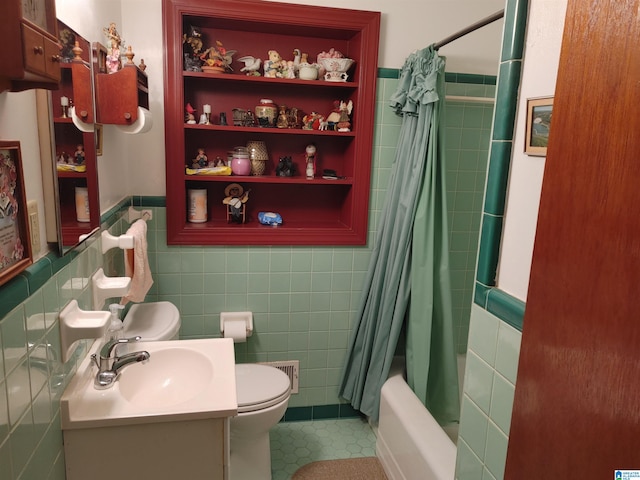 full bathroom featuring tile walls, toilet, and vanity