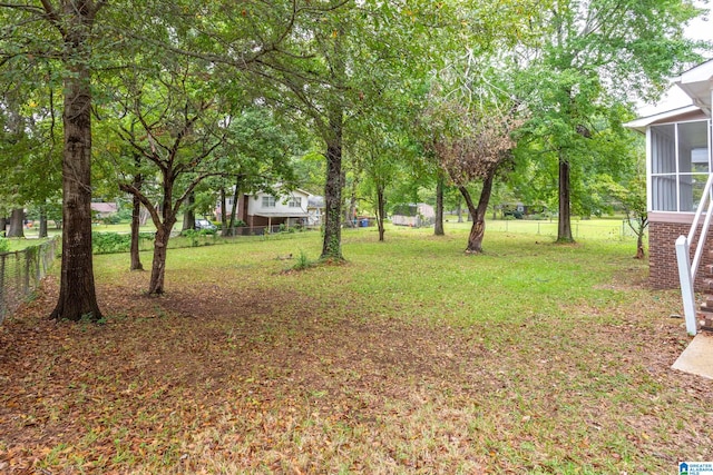 view of yard with a sunroom