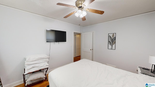 bedroom with hardwood / wood-style flooring and ceiling fan