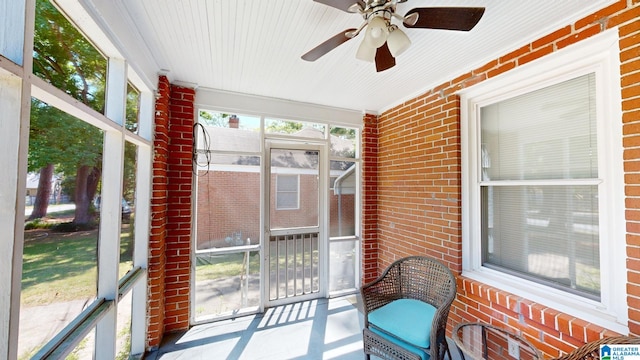 sunroom featuring a wealth of natural light and ceiling fan