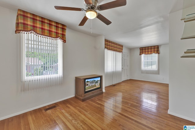 1717 Center Way S, Birmingham, AL 35205 - unfurnished living room with wood finished floors and baseboards
