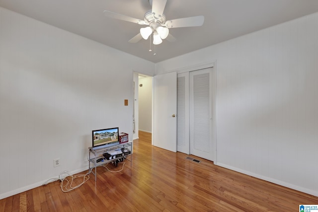 1717 Center Way S, Birmingham, AL 35205 - bedroom with wood finished floors, a closet, ceiling fan, and baseboards