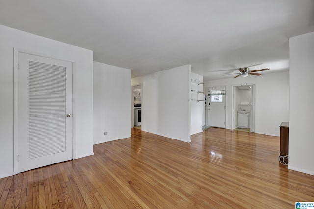 1717 Center Way S, Birmingham, AL 35205 - unfurnished living room featuring ceiling fan, light wood-style flooring, and baseboards
